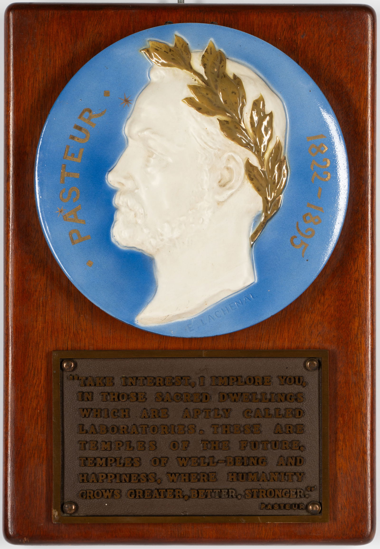 Edmond Lachenal (1855-1948): Pasteur: Edmond Lachenal French 1855-1948 Pasteur glazed ceramic plaque mounted to wooden panel, with metal plate inscribed with a quote from Pasteur; impressed "E. Lachenal" to ceramic 9 1/4 in. (23.5 cm.), O