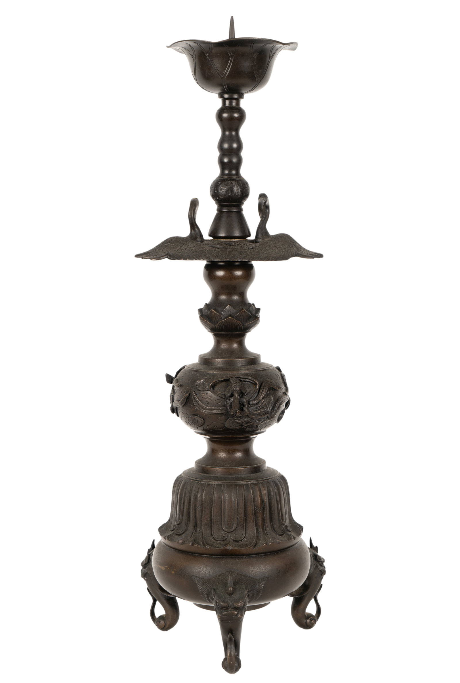 Japanese Bronze Temple Candlestick: Meiji period; in three parts Overall: 27 x 8 in. (68.6 x 20.3 cm.) Provenance: Property from the Estate of Professor Harry Stone, Brentwood, California. Recipient of a Guggenheim Fellowship in the 196