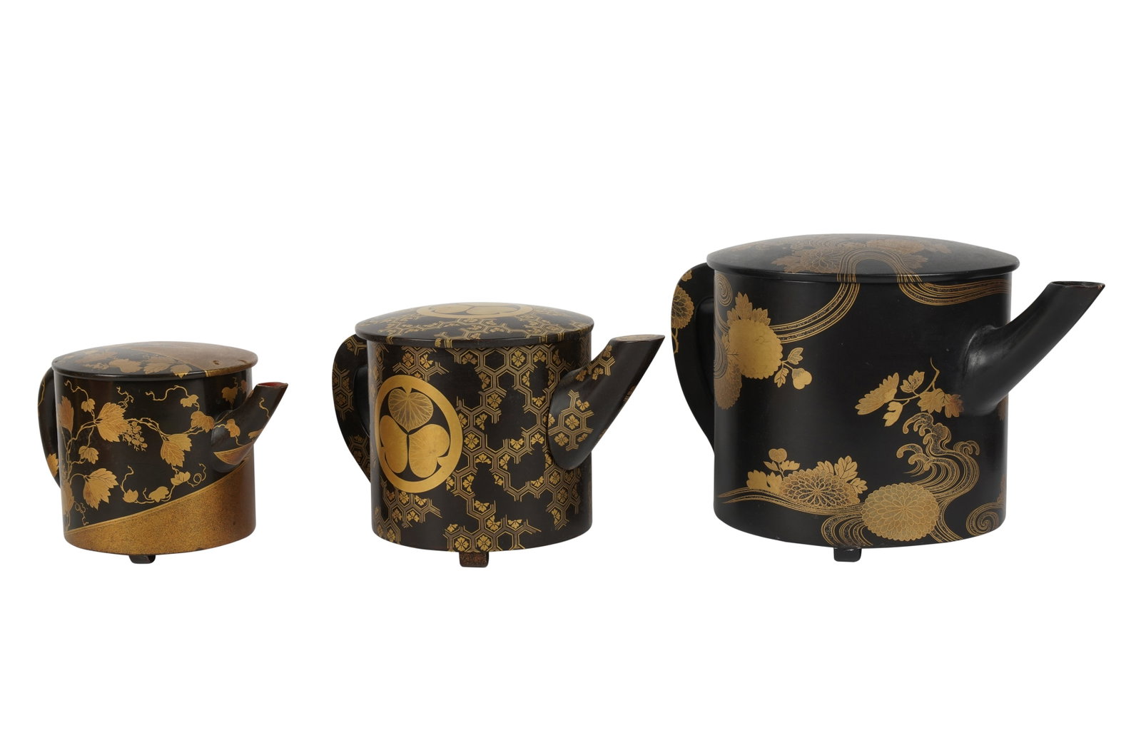 Group of Japanese Black and Gilt Lacquered Teapots: [3 pieces] Ranging from 8 1/2 in. (21.6 cm.) to 6 in. (15.2 cm.) high Provenance: Property from the Estate of Professor Harry Stone, Brentwood, California. Recipient of a Guggenheim Fellowship in the 