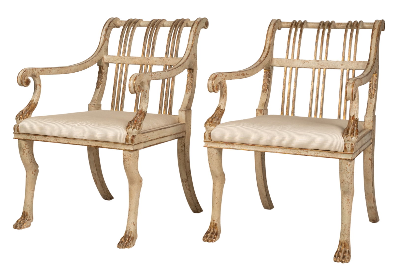 Pair of Rose Tarlow Armchairs: "Brighton"; white-painted and gilt wood, the seats upholstered with white fabric with textured stripes; unsigned 37 1/2 x 25 x 28 in. (95.3 x 63.5 x 71.1 cm.), Seat height: 19 in. (48.3 cm.) Provenanc