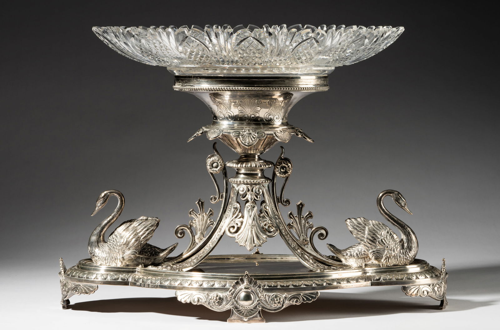 Frederick Elkington Victorian Sterling Swan Centerpiece: Frederick Elkington, Birmingham, 1881 (marked to side of the base and to underside); with cut-glass bowl; approximately 4,090 grams (excluding bowl) 14 x 19 1/2 x 12 in. (35.6 x 49.5 x 30.5 cm.) Prove