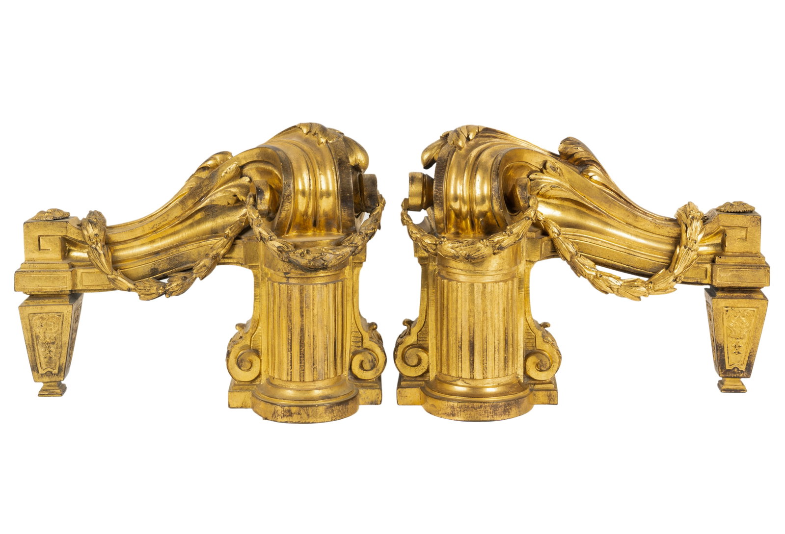 Pair of Louis XVI-Style Gilt Bronze Chenets: unsighed 10 x 13 x 5 in. (25.4 x 33 x 12.7 cm.) Provenance: Property from a Wilshire Corridor Penthouse Estate, Los Angeles, California