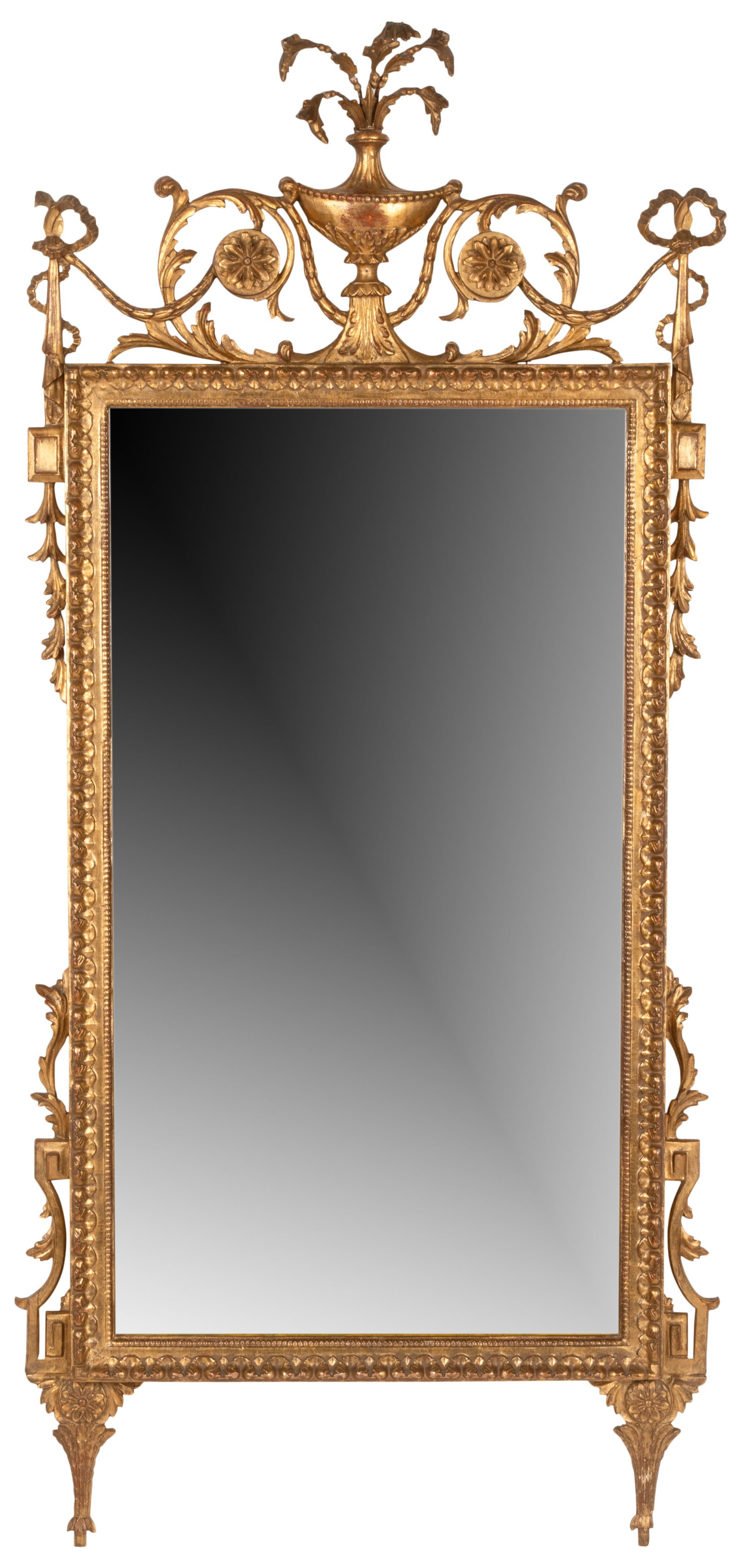 Neoclassical-Style Giltwood Wall Mirror: the flat mirror plate crested by an urn and foliate scrolls suspending bellflowers 53 x 23 3/4 in. (134.6 x 60.3 cm.) Provenance: Property from a Wilshire Corridor Penthouse Estate, Los Angeles, Calif