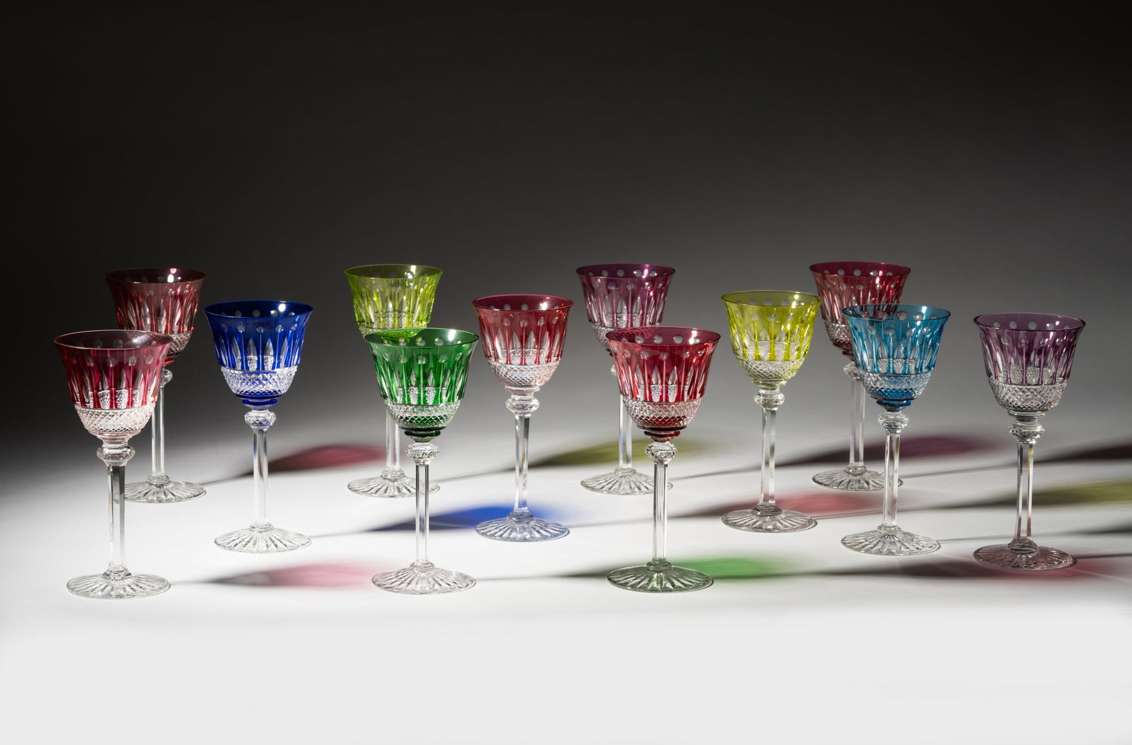 Set of 12 Assorted Saint Louis Colored Crystal Hock Wine Glasses: "Tommy"; each stamped to underside 7 3/4 x 3 1/2 in. (19.7 x 8.9 cm.)