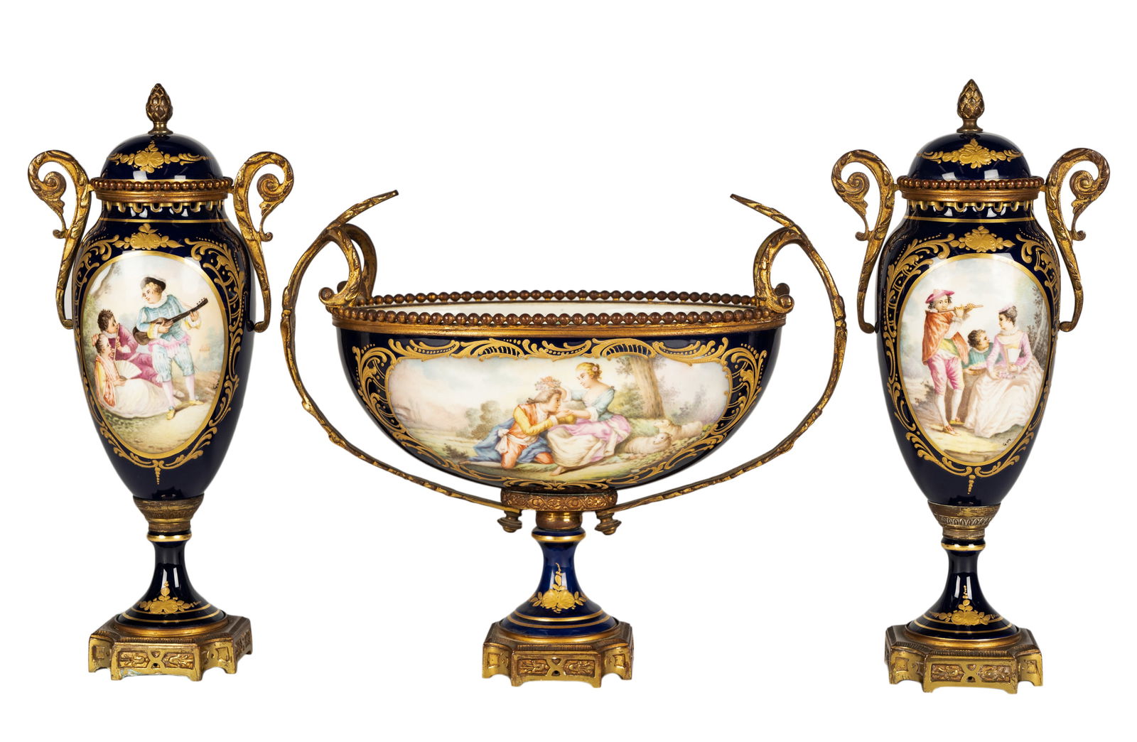 Sevres-Style Cobalt-Ground Porcelain Garniture Set: each with a hand-painted scene of figures, unsigned; each impressed "France" to underside of base; comprising a center bowl, 10 x 12 x 6 in. (25.4 x 30.5 x 15.2 cm.), and a pair of covered urns, 12 1/