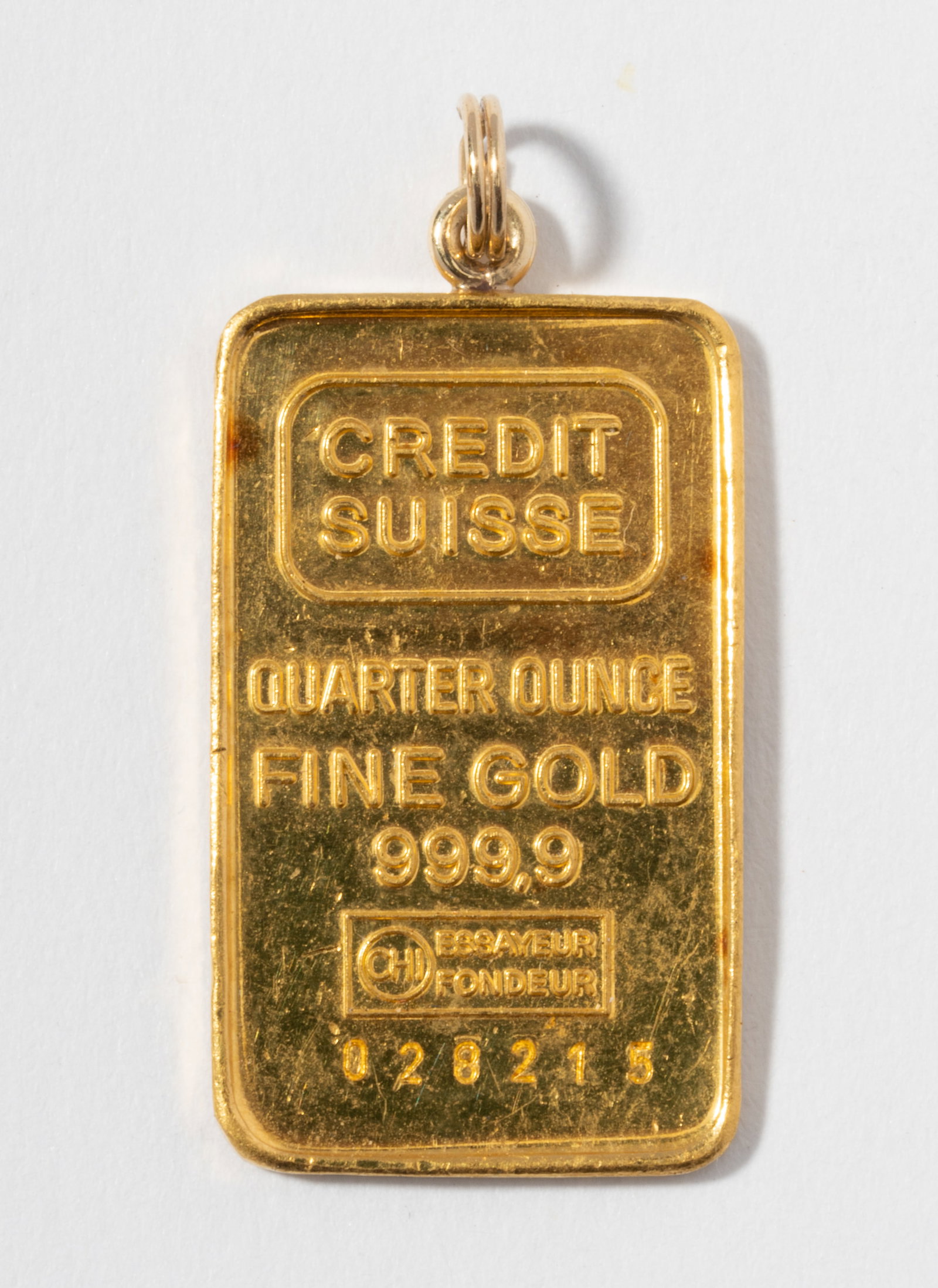 Quarter Ounce Gold Pendant: measuring 25.2 mm x 15.2 mm (not including bail); weighing 7.92 grams total;