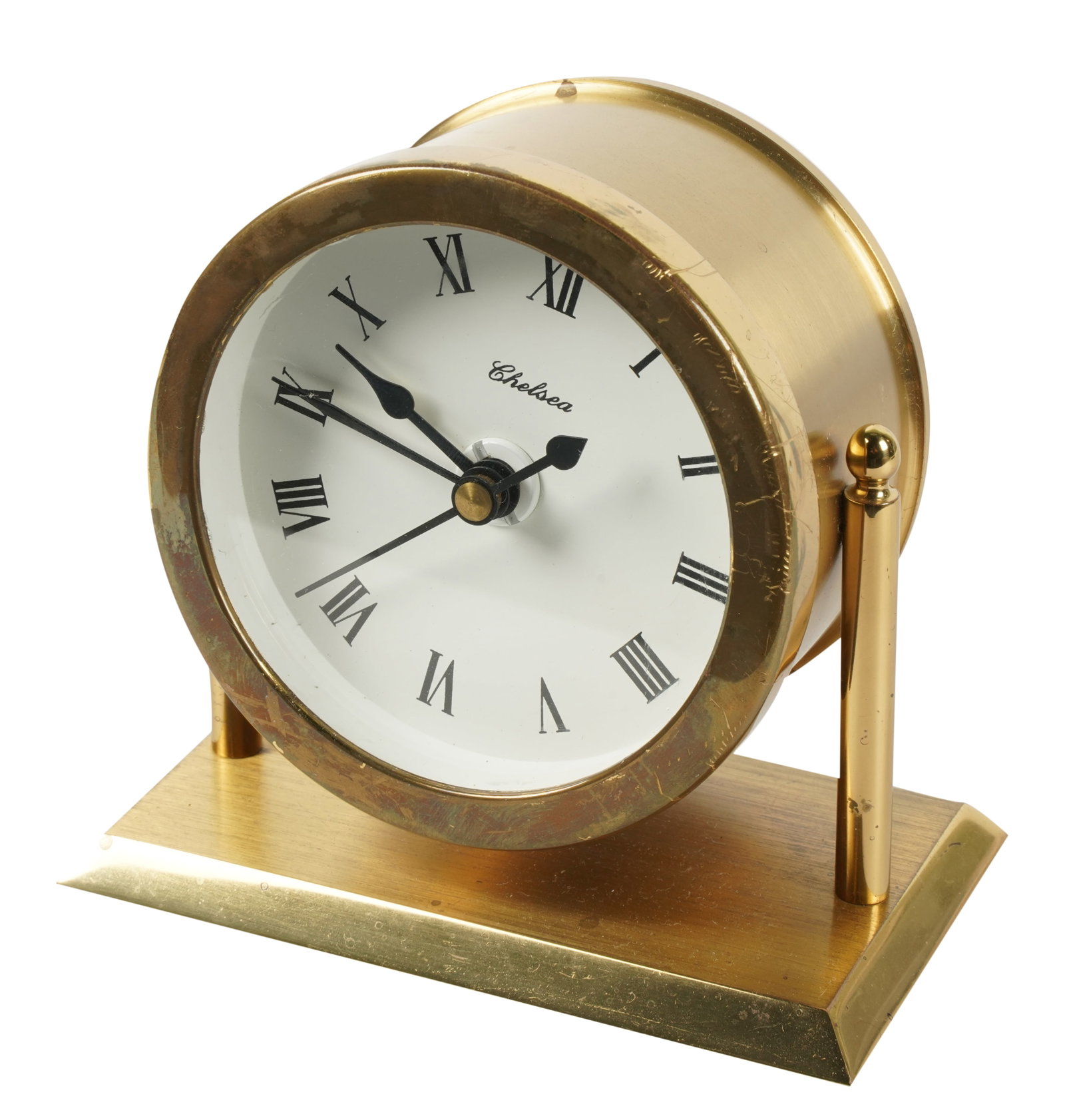 Brass Chelsea Clock: the battery movement signed "Kienzle Quartz Germany" 5 x 5 x 2 3/4 in. (12.7 x 12.7 x 7 cm.) Provenance: Property from a Wilshire Corridor Penthouse Estate, Los Angeles, California