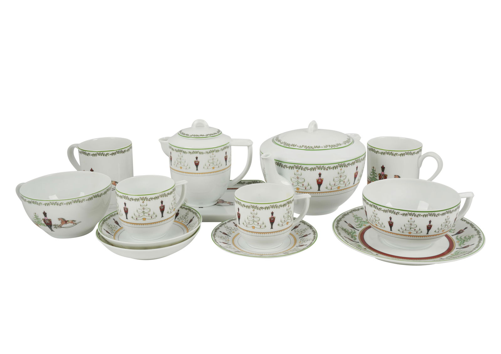 Bernardaud Grenadiers Porcelain Dessert Service: "Happy Holiday" pattern; comprising a teapot (5 3/4 in. high); two creamers no lids (4 1/2 in. high); a covered sugar bowl (4 1/4 in. high); six mugs (3 5/8 in. high); two saucers (5 1/2 in. dia.); si