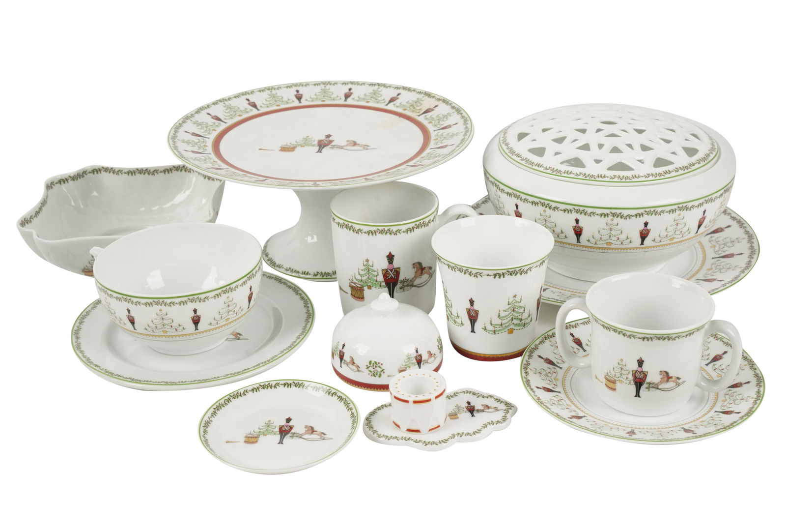 Bernardaud Grenadiers Porcelain Service: "Happy Holiday" pattern; comprising 13 chargers (11 7/8 in. dia.); 10 dinner plates (10 1/4 in. dia.); 13 salad plates (8 3/8 in. dia.); one oval platter (10 x 13 1/4 in.); two candlesticks (1 1/4 x 4