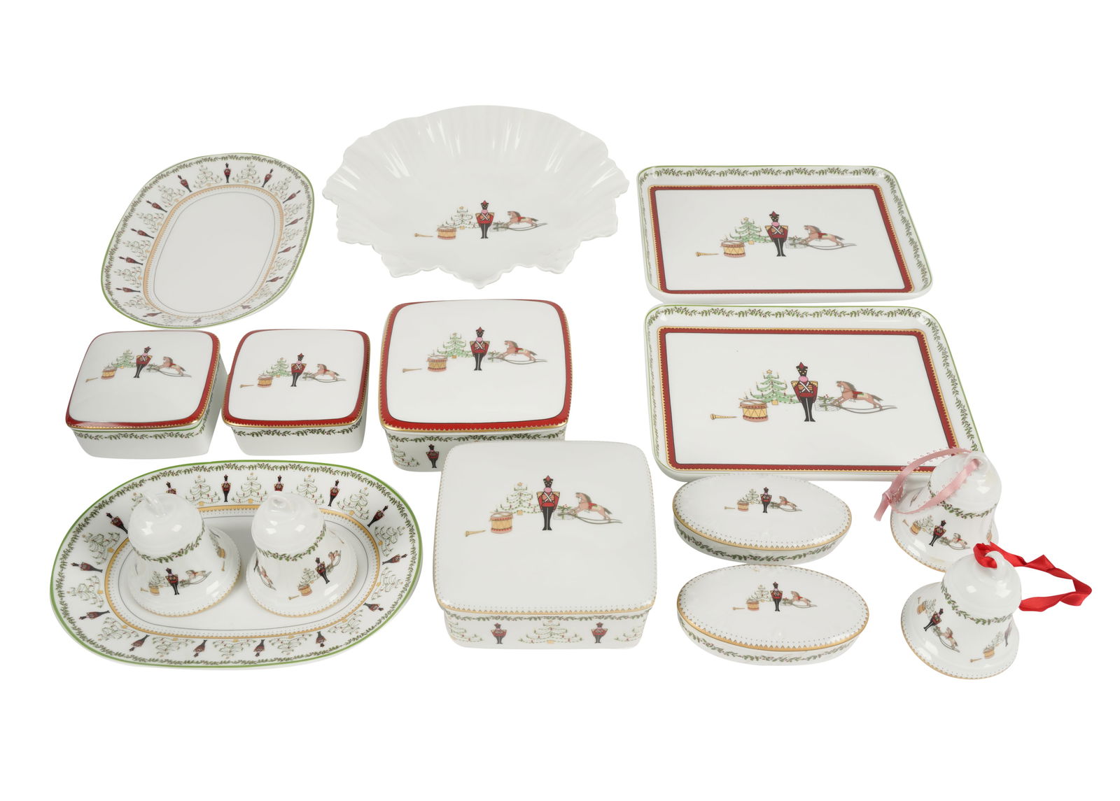 Bernardaud Grenadiers Porcelain Partial Service: "Happy Holiday" pattern; comprising four bell ornaments (3 x 2 1/2 in.); two rectangular trays (6 1/4 x 8 1/4 in.); two oval relish trays (5 7/8 x 8 1/4 in.); a bowl (9 in. dia.); four square covered