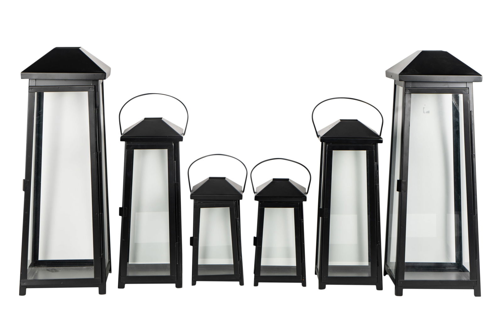 Six Crate and Barrel Metal and Glass Lanterns: label to underside Ranging from 12 1/4 in. (31.1 cm.), to 28 in. (71.1 cm.)