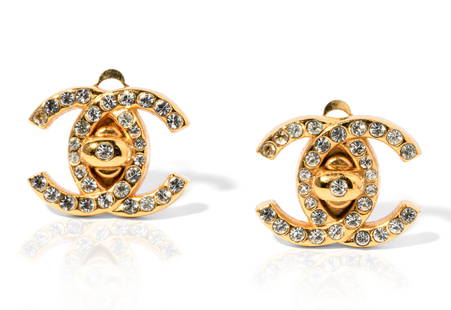 Chanel Gold-tone and Rhinestone ?CC? Earrings: Gold-tone "Chanel" interlocking "C" motif earrings with clip backs, set with 62 round near colorless Rhinestones, 1.50 mm. to 2.00 mm. each in diameter, 9.7 grams, 21.00 x 16.00 mm. each in diameter