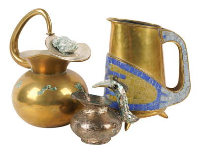 Group of Mexican Brass Pitchers: comprising a Salvador Teran brass and mosaic pitcher (8 1/2 in. high) and two Los Castillo pitchers (one silver-plate with shell-veneered bird-form handle, 4 3/4 in. high, the other brass with stone i