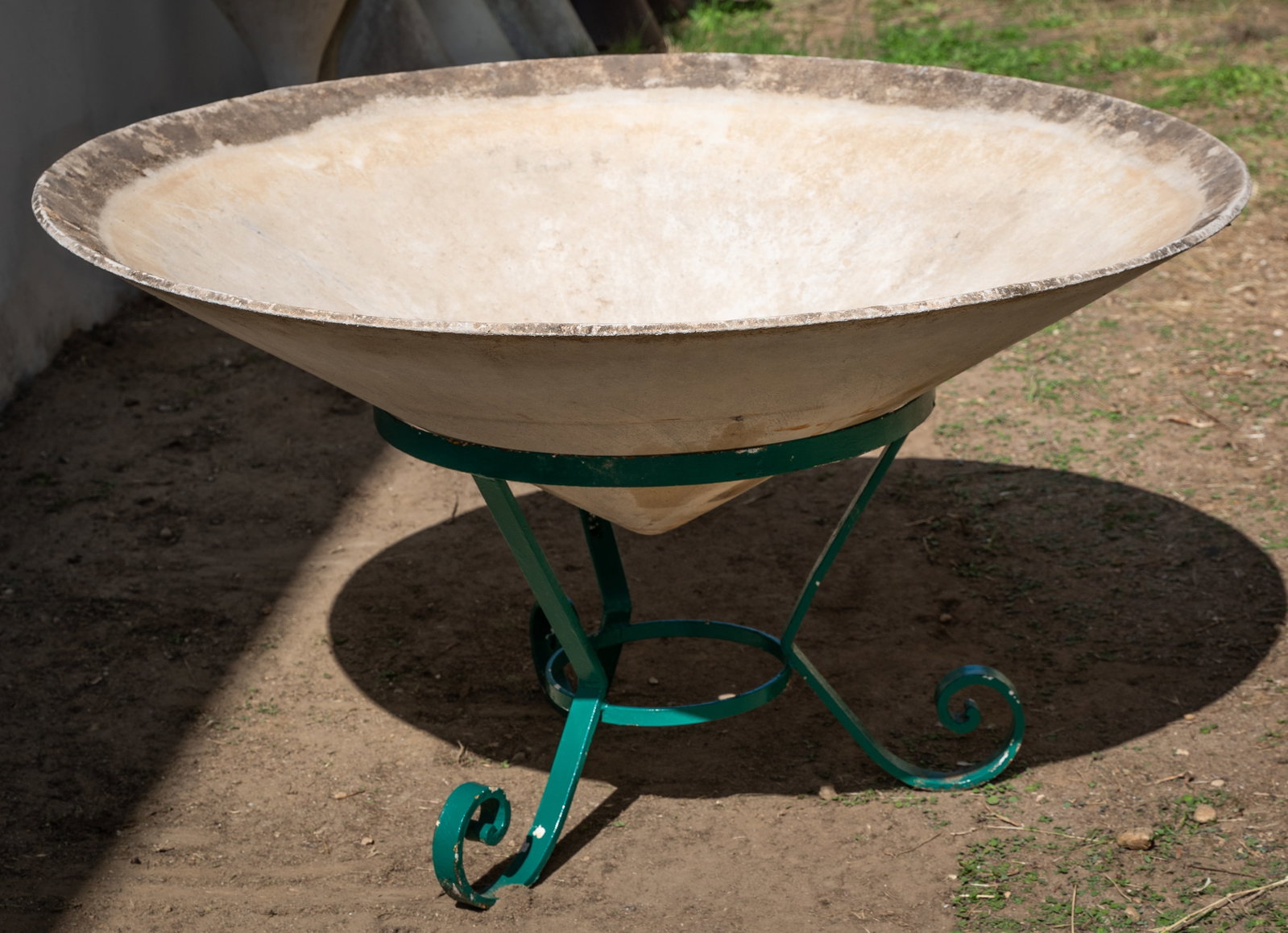 Willy Guhl (1915-2004): Saucer Planter: manufactured by Eternit, Switzerland; fiber-reinforced concrete, with metal stand 26 x 47 in. (66 x 119.4 cm.)