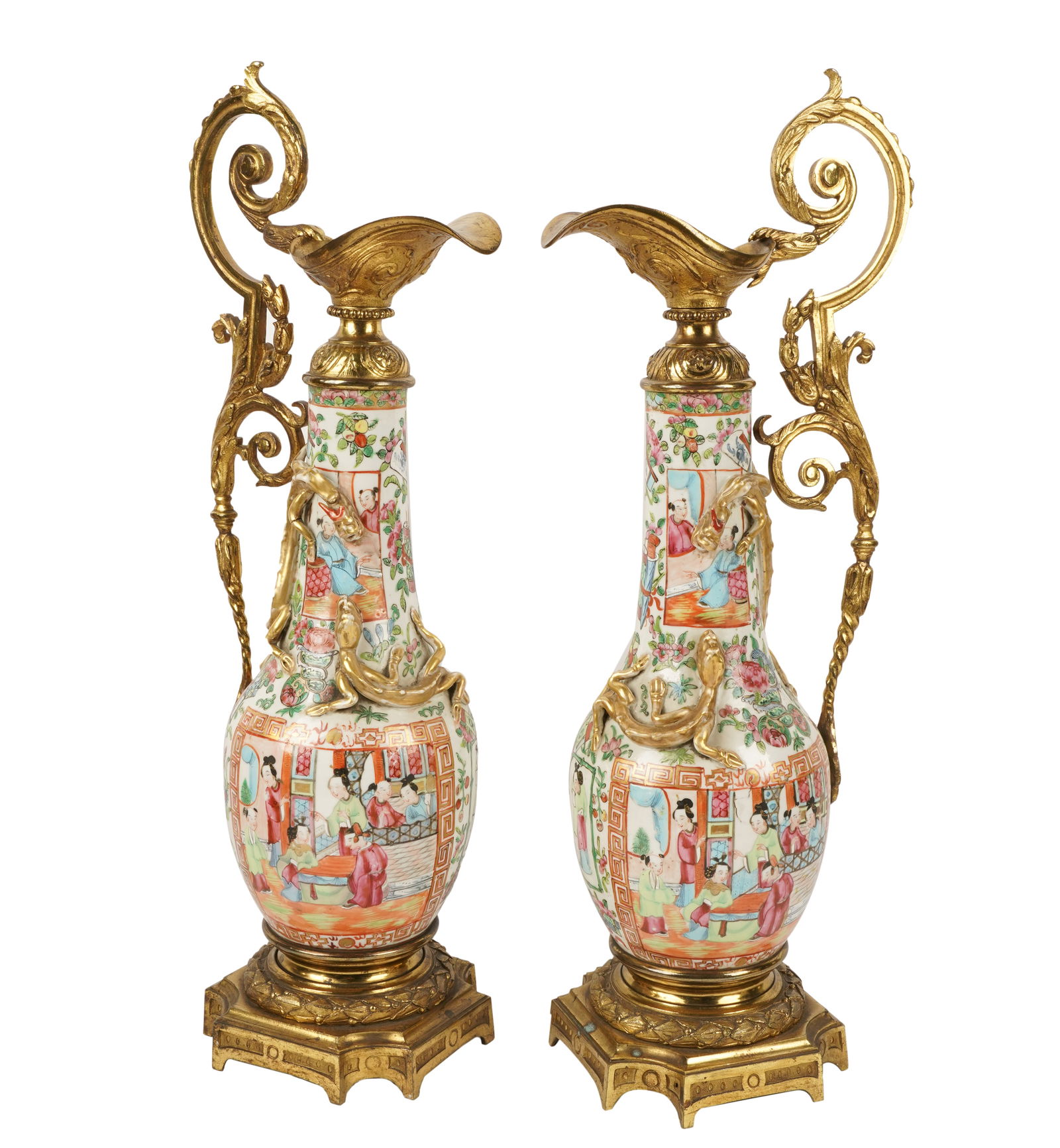 Pair of Chinese Canton Ewers: attached on brass bases with brass handles and spouts 19 x 7 3/4 x 4 3/4 in. (48.3 x 19.7 x 12.1 cm.)