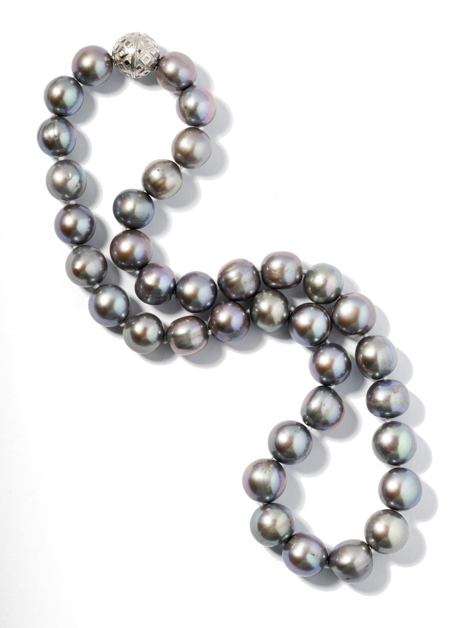 Grey Colored Cultured Pearl Necklace: Single uniform strand-style necklace consisting of 36 semi-spherical drilled Tahitian Cultured Pearls, 9.72 mm. to 11.47 mm. each in diameter, completed with a sterling silver magnetic ball clasp, 16 