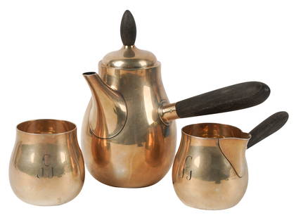 Allan Adler Three-Piece Sterling Tea Service: comprising a teapot (7 1/2 in. high) and creamer (3 in. high), each with wooden handle, and an open sugar (3 in. high); each monogrammed "C J J"; each marked "Allan Adler / Sterling" Approximately 32