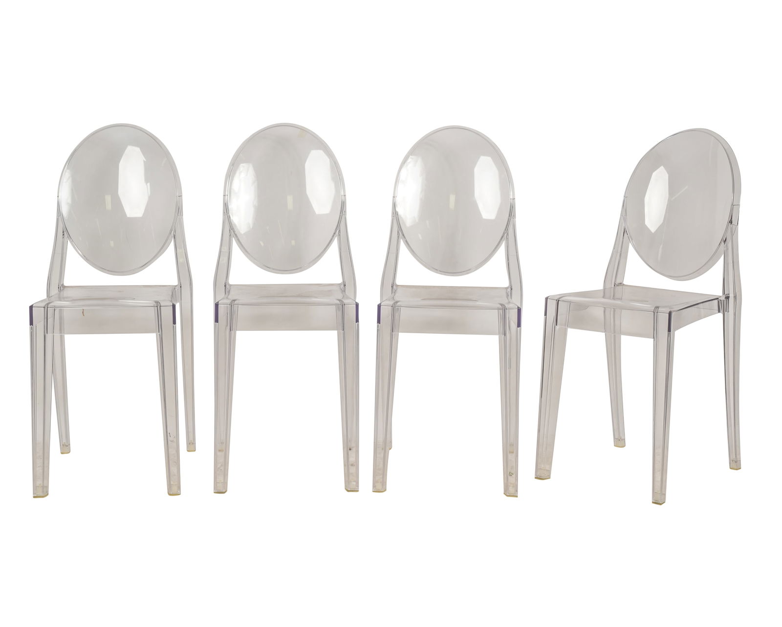 Philippe Starck for Kartell: Set of Four Victoria Ghost Chairs: acrylic; with molded and adhesive manufacturer's labels 35 3/4 x 14 x 18 1/2 in. (90.8 x 35.6 x 47 cm.), Seat height: 19 in. (48.3 cm.)