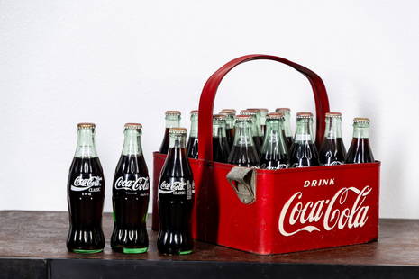 Vintage Coca-Cola Embossed Metal Stadium 20-Pack Carrier with Bottles: includes a bottle opener, embossed at both ends, lettering with white pant Carrier: 12 x 12 1/4 x 10 1/2 in. (30.5 x 31.1 x 26.7 cm.), Bottles: 7 1/2 in. (19.1 cm.) Provenance: The Private Collection