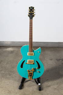 Cort J. Triggs Guild TRG-1 Sea Foam Green Semi-Hollow Body Electric Guitar with Soft Case: late 1990s, Korean made guitar designed by Jim Triggs for Cort 42 x 16 x 3 3/4 in. (106.7 x 40.6 x 9.5 cm.) Provenance: The Private Collection of Robin Chretien, founder of Robin's Jean