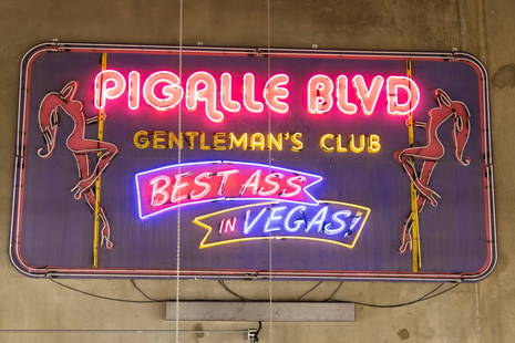 Vintage Pigalle Blvd. Gentleman's Club Neon Sign: "Best Ass in Vegas" neon sign, painted wood approximately: 102 x 198 x 4 in. (259.1 x 502.9 x 10.2 cm.) Provenance: The Private Collection of Robin Chretien, founder of Robin's Jean