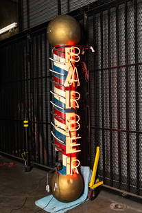 Vintage Barber Shop Pole Advertising Neon Sign: signed on the backside "Anything Neon", with modern cords, and on one side with "Barber Shop" lettering in neon 98 x 30 x 30 in. (248.9 x 76.2 x 76.2 cm.) Provenance: The Private Collection of Robin C
