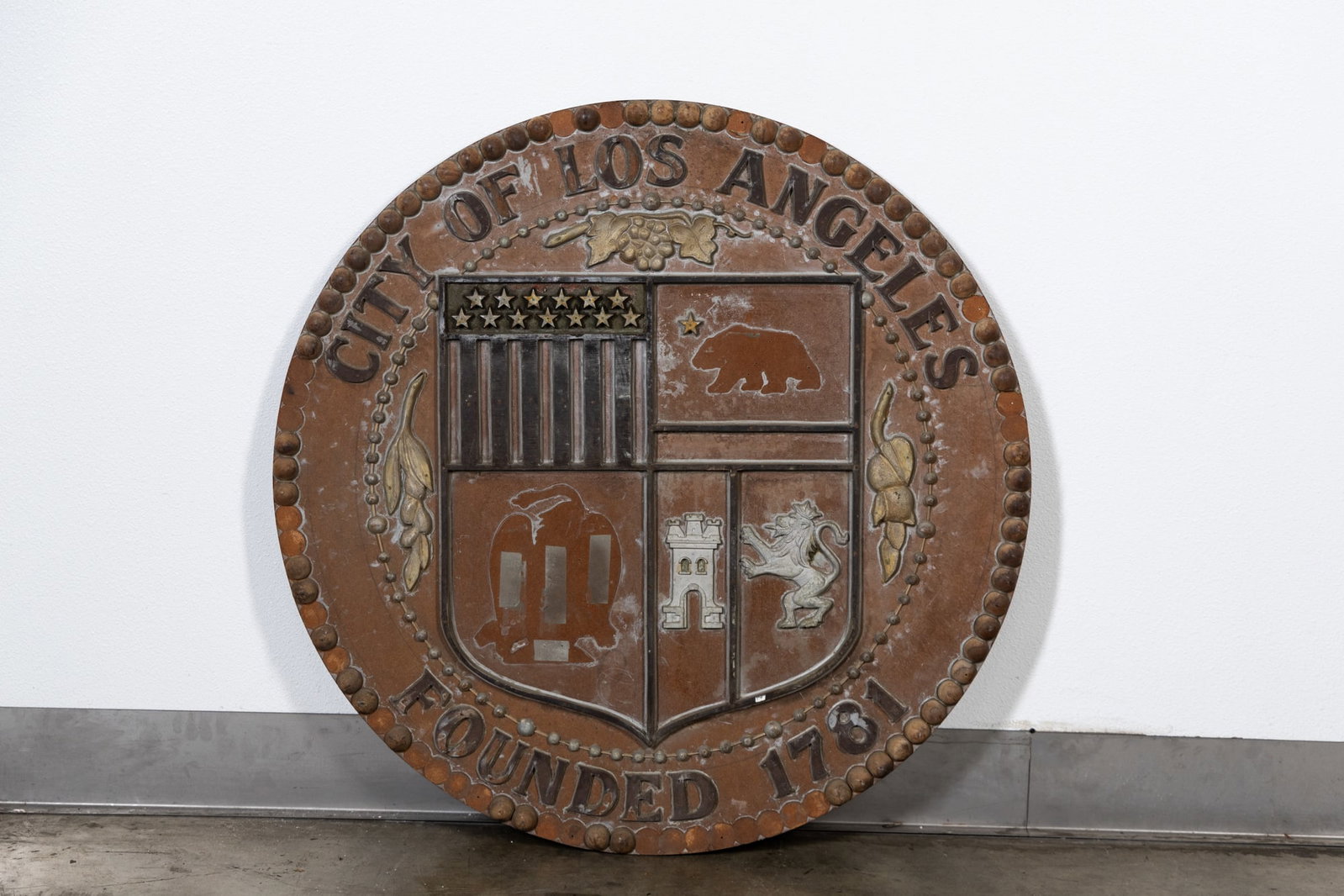 Folk Art-style City of Los Angeles, Founded in 1751 Plaque: unsigned 36 x 36 in. (91.4 x 91.4 cm.) Provenance: The Private Collection of Robin Chretien, founder of Robin's Jean