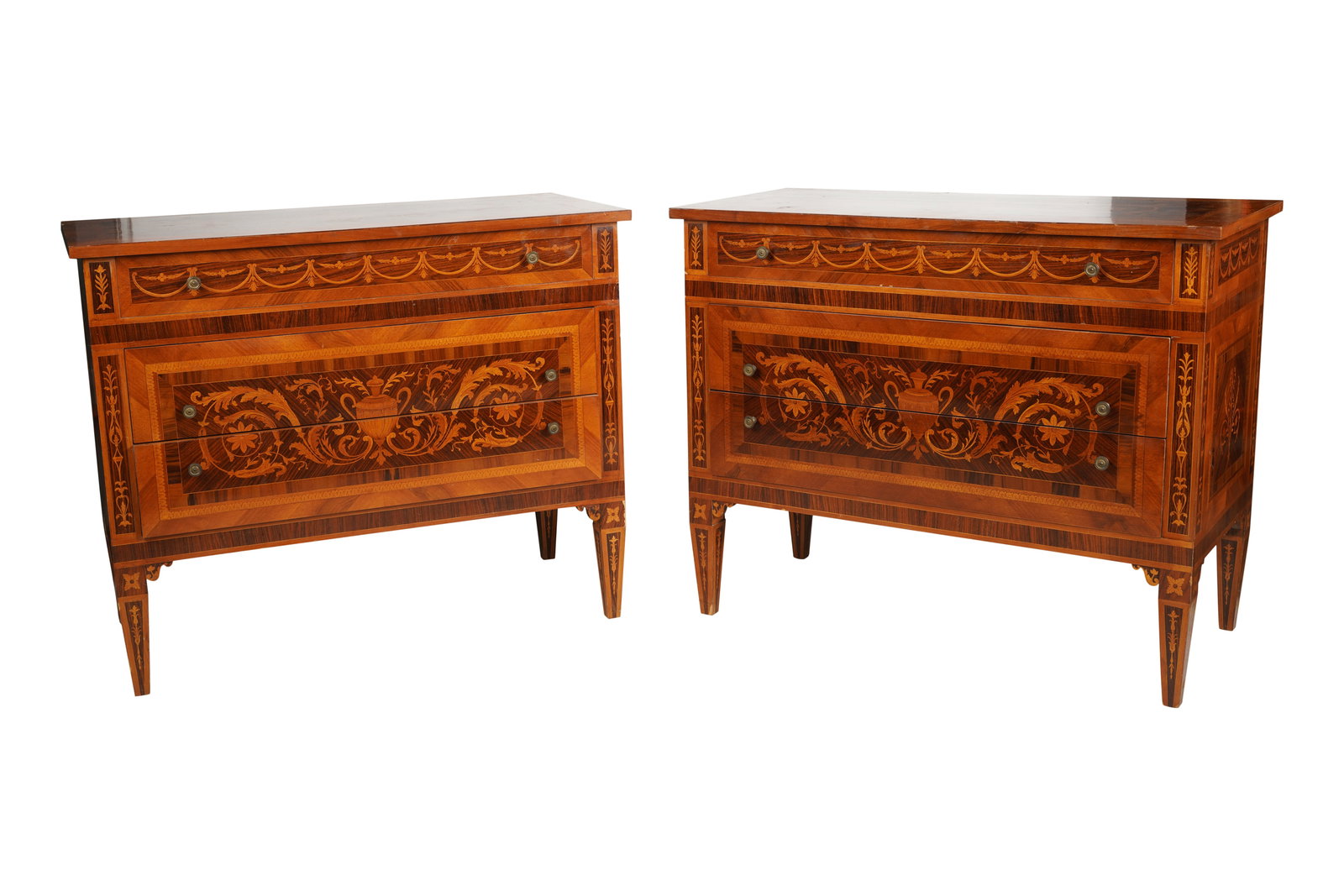 Pair of Neoclassical-Style Marquetry Commodes: each with three drawers 36 1/2 x 45 x 21 1/2 in. (92.7 x 114.3 x 54.6 cm.) Provenance: Property from the Estate of Nick Chavez, the revered hairstylist behind the exclusive Nick Chavez Beverly Hills h