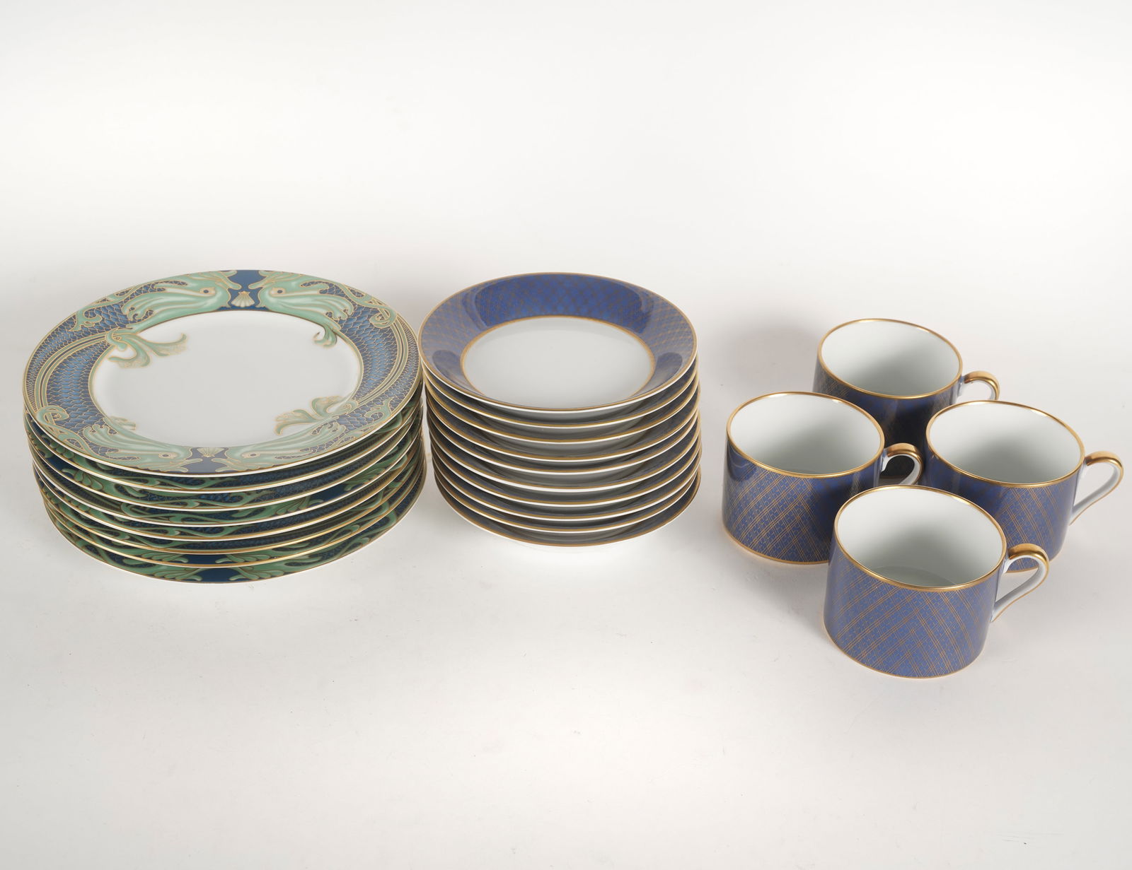 Group of Fitz and Floyd Porcelain: comprising 10 "Imperial Dynasty" flat cups (2 in. high), 10 "Imperial Dynasty" saucers (5 1/2 in. dia.) and eight "Green Dolphin Street" salad plates (7 1/2 in. dia.); each with printed factory marks