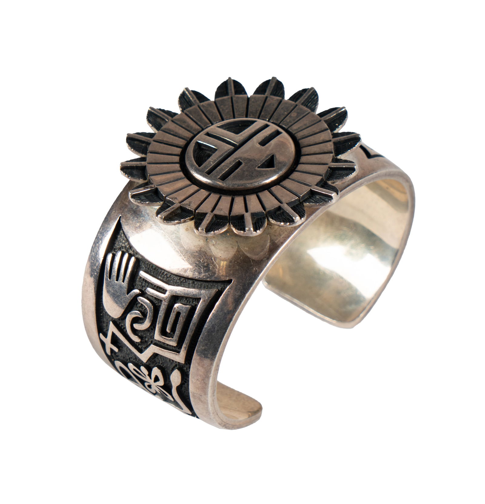 Cheston Dalangyawma Hopi Sterling Cuff: signed; approximately 141 grams 6 in. interior circumference Provenance: Property from the Estate of Larry Mendelson, Encino, CA