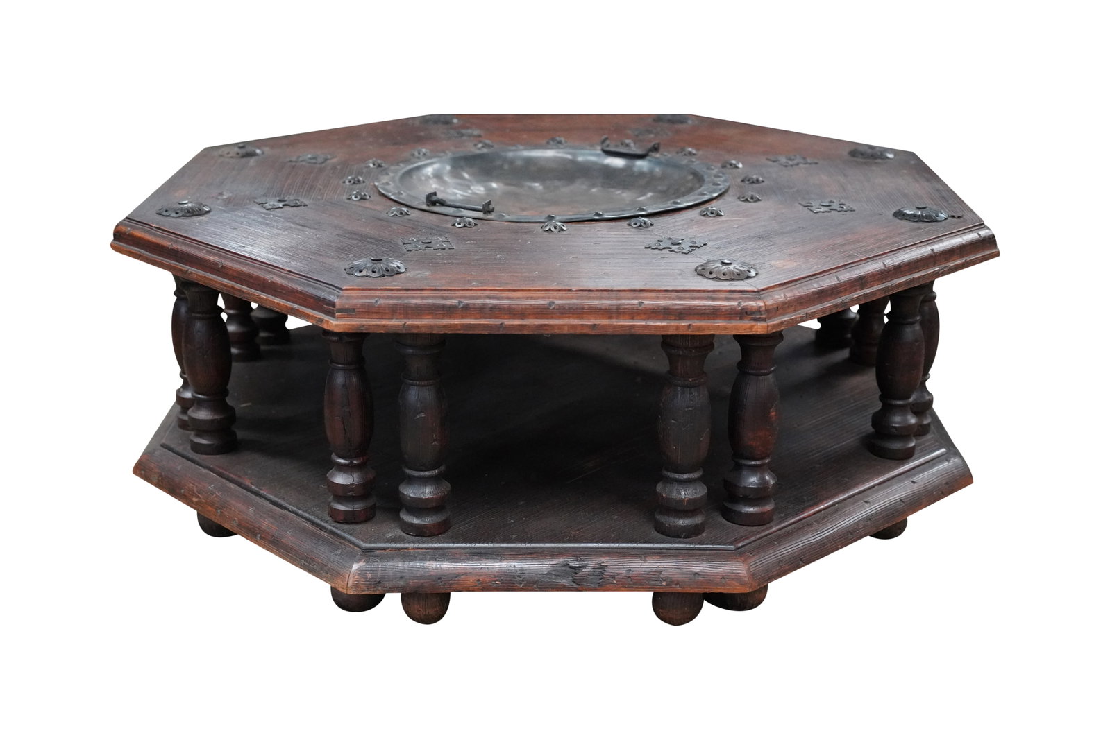 Brazier-Inset Octgonal Coffee Table: copper, stained wood 18 1/2 x 50 in. (47 x 127 cm.) Provenance: Estate property from a Palos Verdes, CA chateau