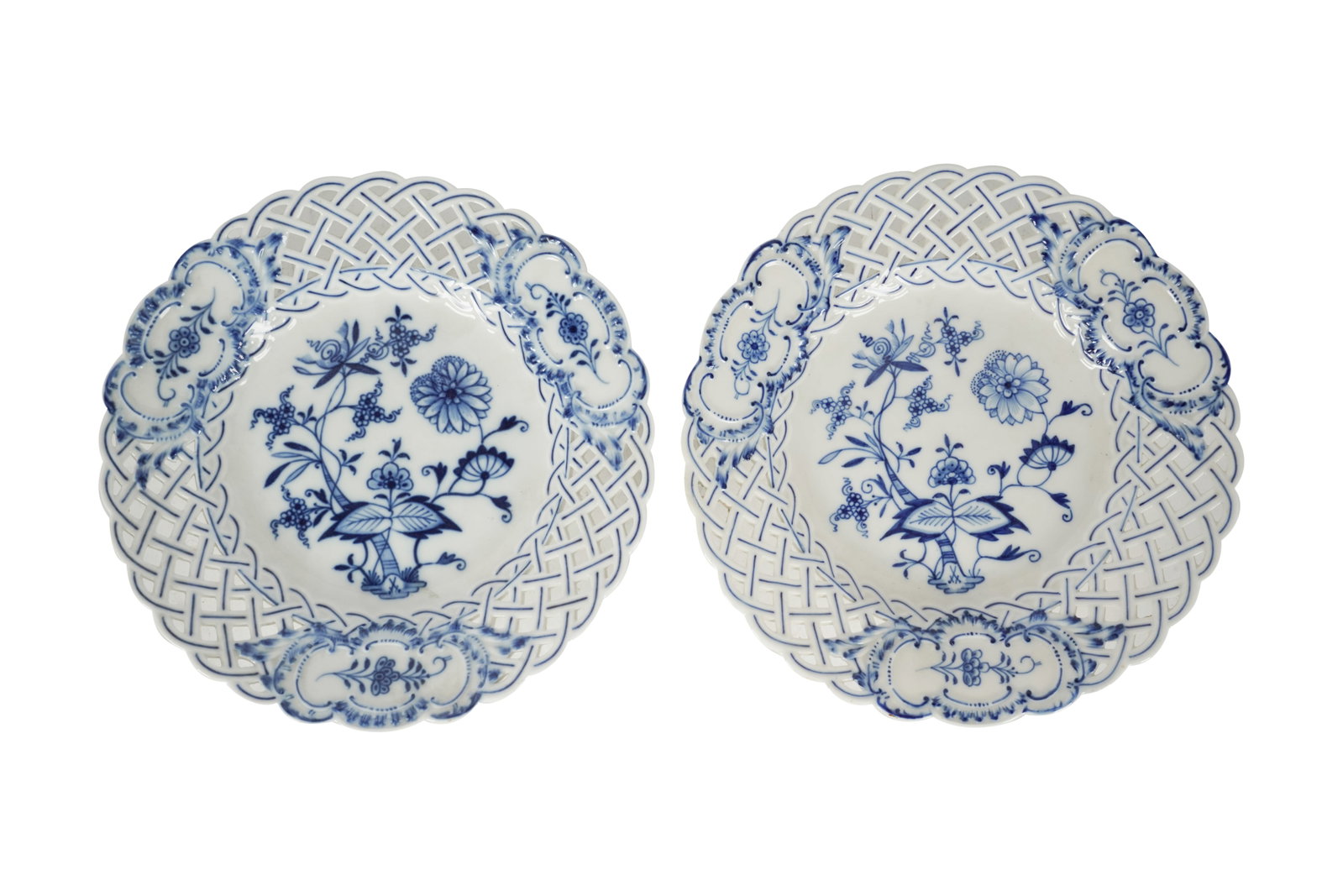 Pair of Meissen Blue Onion Reticulated Porcelain Plates: each with blue painted crossed swords mark and impressed "90" and "56" and with painted cipher Each 8 1/4 in. (21 cm.) dia. Provenance: Estate property from a Palos Verdes, CA Chateau