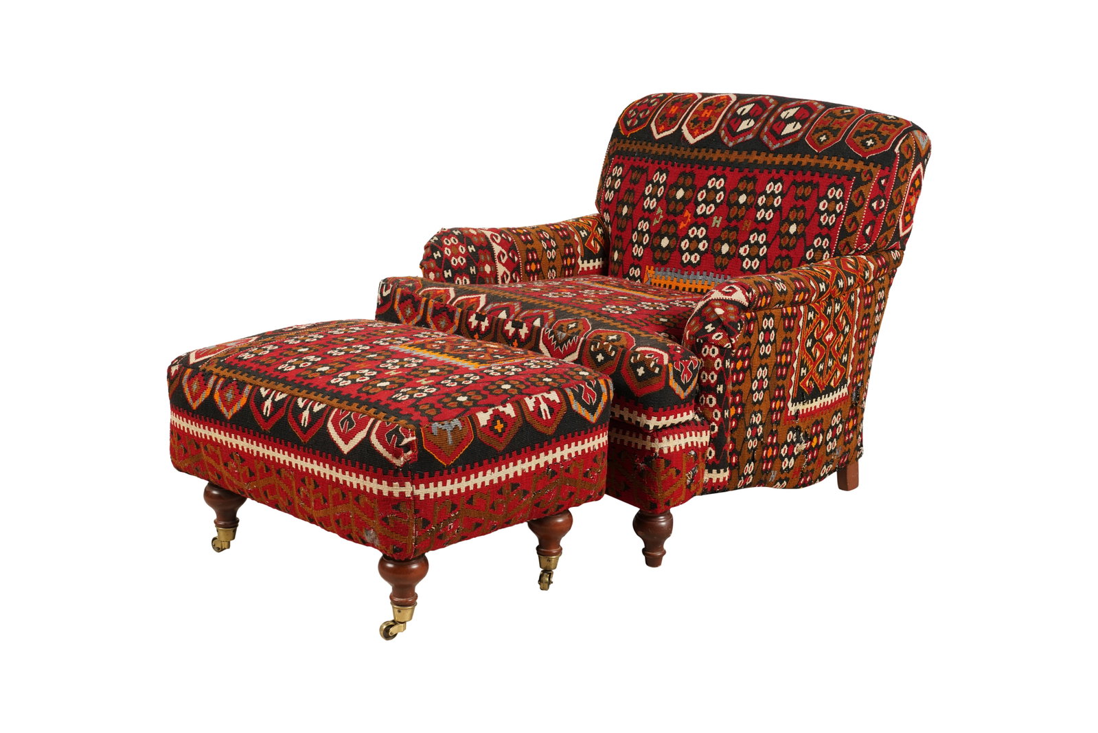 Kilim-Upholstered Club Chair and Ottoman: each on wooden feet, the ottoman with casters Chair: 33 x 34 x 34 in. (83.8 x 86.4 x 86.4 cm.), Seat height: 17 1/2 in. (44.5 cm.), Ottoman: 17 x 28 x 21 in. (43.2 x 71.1 x 53.3 cm.) Provenance: Prope