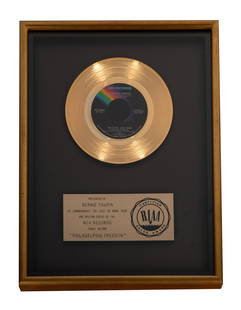 Bernie Taupin's Gold Record for Elton John's Philadelphia Freedom: the presentation plaque inscribed "Presented to Bernie Taupin to commemorate the sale of more than one million copies of the MCA records single record "Philadelphia Freedom" 17 x 13 in. (43.2 x 33 cm.