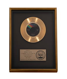 Bernie Taupin's Gold Record for Elton John's Goodbye Yellow Brick Road: the presentation plaque inscribed "Presented to Bernie Taupin to commemorate the sale of more than one million copies of the MCA Records single record 'Goodbye Yellow Brick Road'" 17 x 13 in. (43.2 x