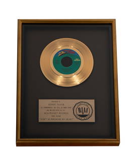 Bernie Taupin's Gold Record for Elton John's Don't Go Breaking My Heart: the plaque inscribed "Presented to Bernie Taupin to commemorate the sale of more than one million copies of the MCA / Rocket Records single record 'Don't Go Breaking My Heart'" Frame: 17 x 13 in. (43.