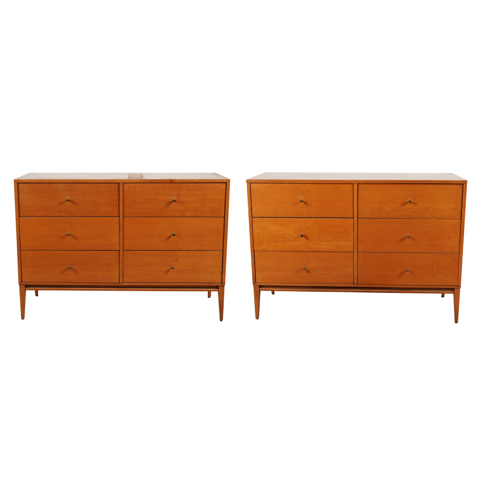 Pair of Paul Mccobb Dressers: each with label Planner Group Designed by Paul Mccobb to interior of drawer, each with six pull-out drawers 33 1/2 x 48 x 18 1/2 in. (85.1 x 121.9 x 47 cm.)