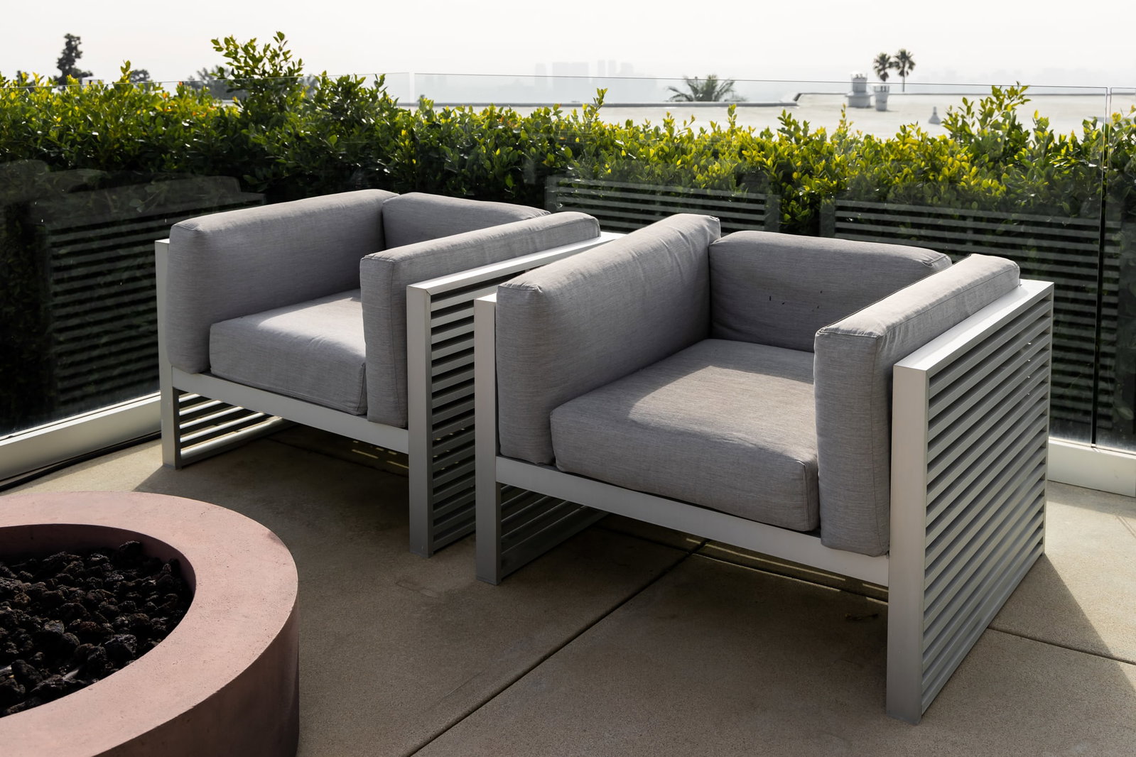 Gandia Blasco Pair of DNA Lounge Chairs: aluminium with weather-upholstered cushions 26 x 41 x 35 in. (66 x 104.1 x 88.9 cm.), seat height: 18 in. (45.7 cm.) Provenance: Beverly Hills private residence, from gandiablasco.com: "Mediterranean 