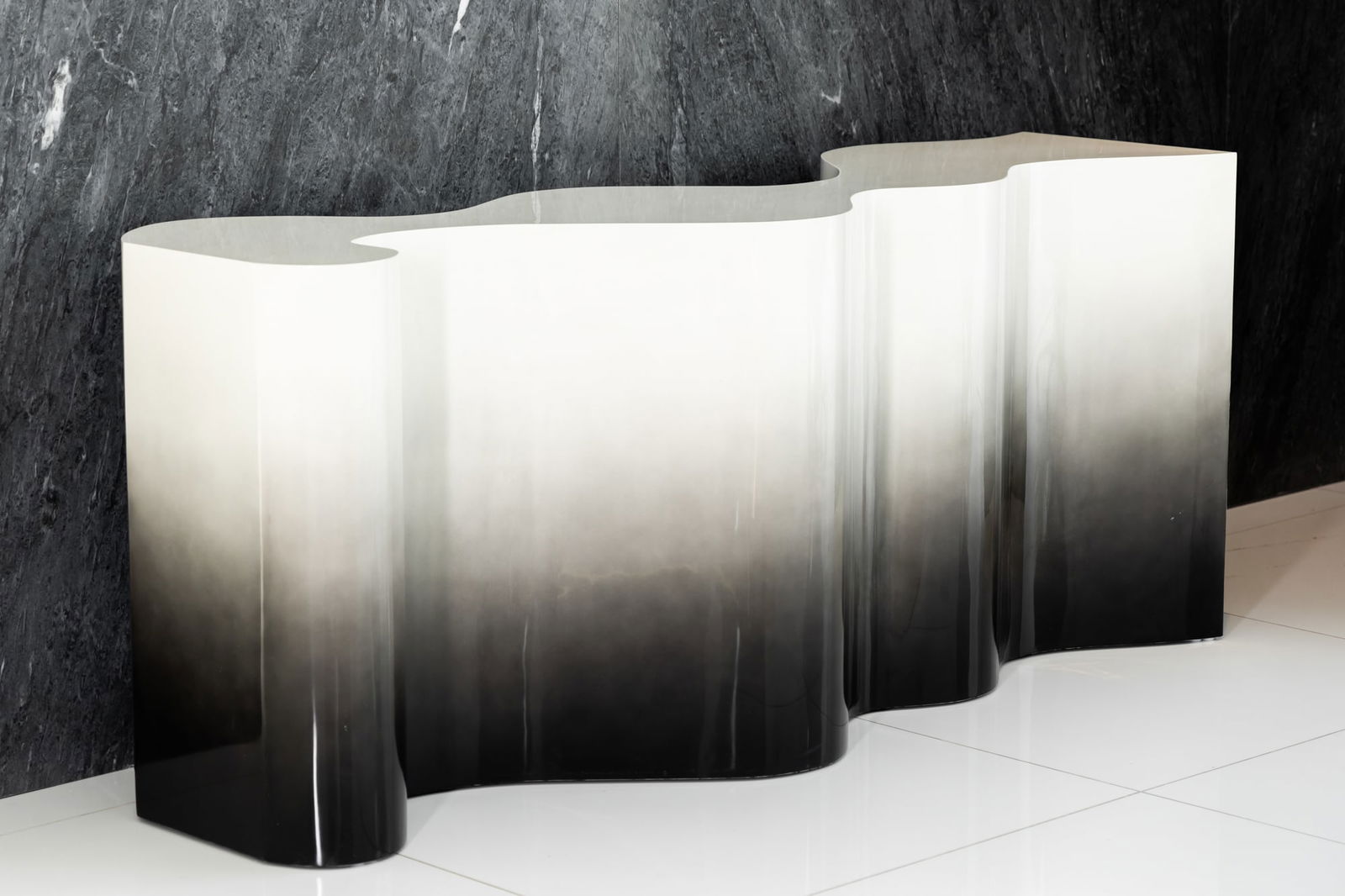 Lacquered Two-Tone Console: unmarked with asymmetrical design 33 3/4 x 79 1/2 x 20 in. (85.7 x 201.9 x 50.8 cm.) Provenance: Beverly Hills private residence