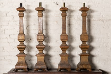 A Set of Four Continental Baroque-Style Giltwood Altar Sticks