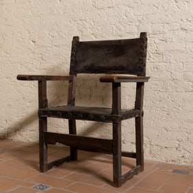 A Spanish Baroque Walnut and Leather Armchair