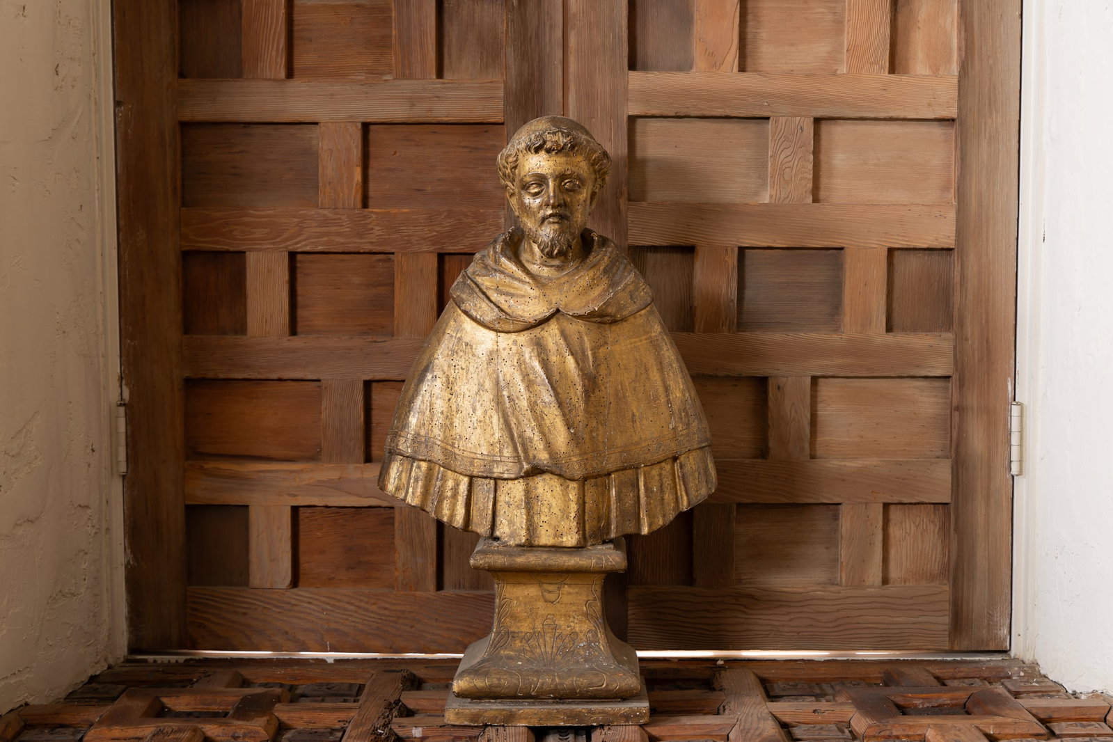 A Continental Carved Giltwood Altar Bust: 18th century; depicting a bearded man wearing a vestment with incised border 28 1/2 x 16 1/4 x 7 1/4 in. (72.4 x 41.3 x 18.4 cm.) Provenance: Property from the Estate of Francis and Marion Lederer