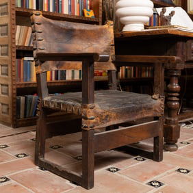 A Spanish Baroque-Style Walnut and Leather Armchair