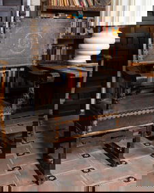 An Italian Baroque Carved Walnut and Tooled Leather Cardinal's Chair