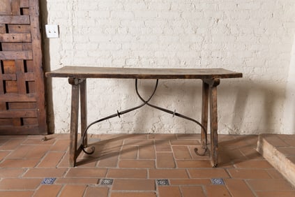 A Spanish Baroque Walnut and Wrought Iron Trestle Table