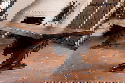 An Italian Carved Walnut and Iron Refectory Table