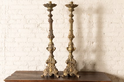 A pair of Continental Baroque-Style Cast Brass Altar Sticks
