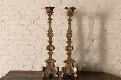 A Pair of Italian Baroque Carved Giltwood Altar Sticks