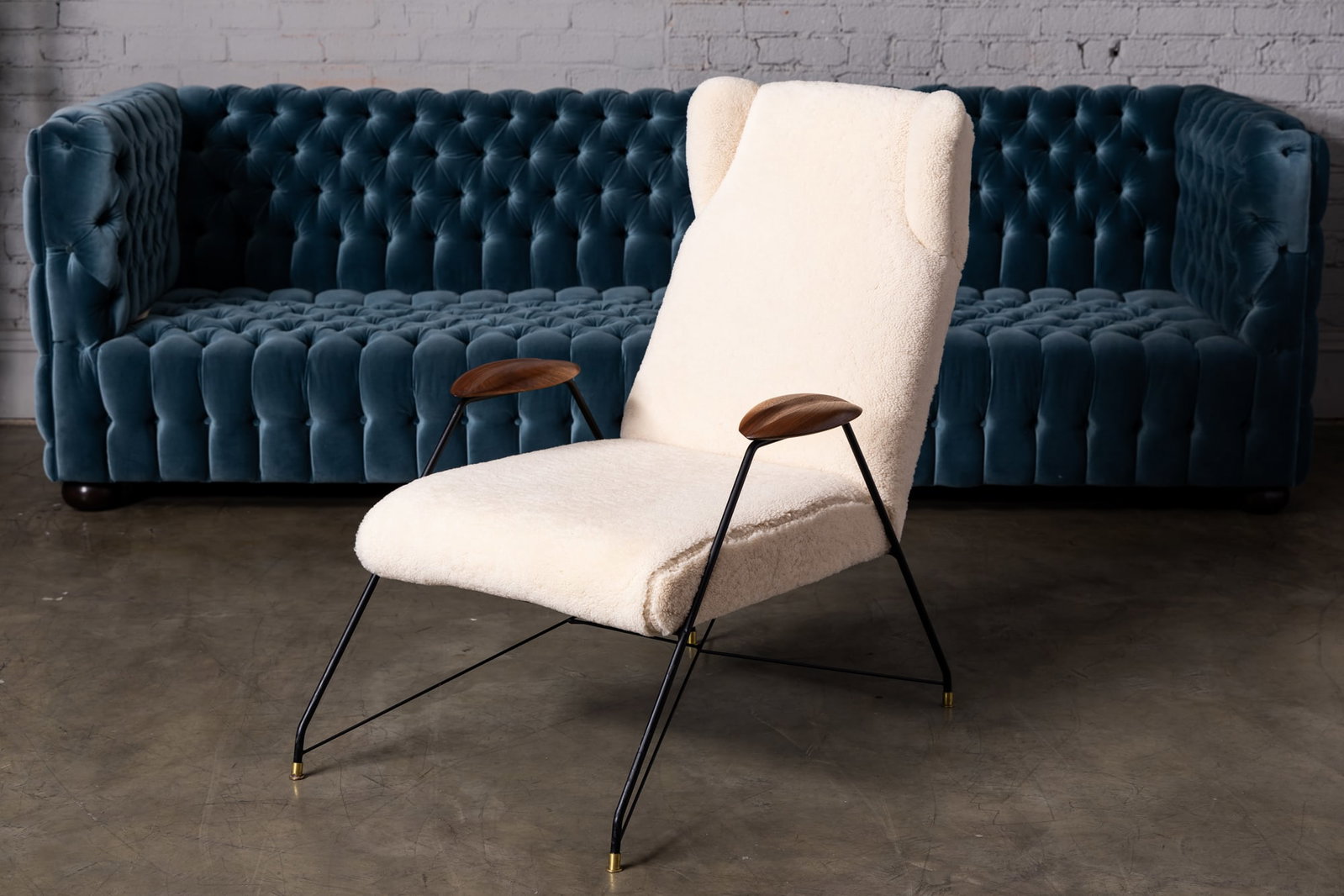 Adesso Imports Studio Line: Mid-Century Modern-Style Lounge Chair: sheepskin, enameled metal, walnut 38 x 26 x 40 in. (96.5 x 66 x 101.6 cm.), Seat height: 16 in. (40.6 cm.) Provenance: Property from The Private Collection of International Architect and Designer Selm