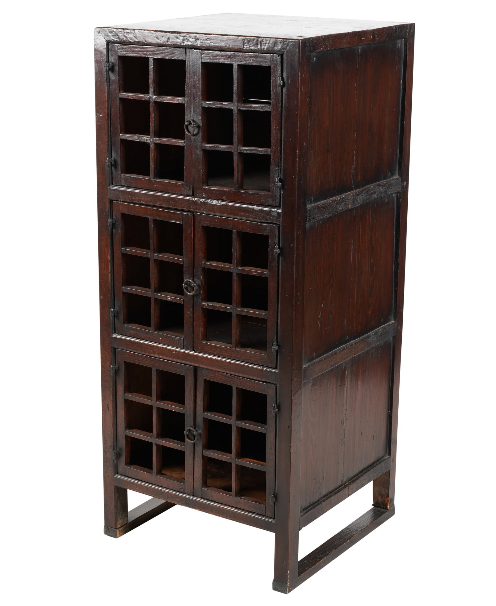 An Antique Korean Cabinet: with three pairs of latticed doors 48 1/2 x 21 x 20 in. (123.2 x 53.3 x 50.8 cm.)